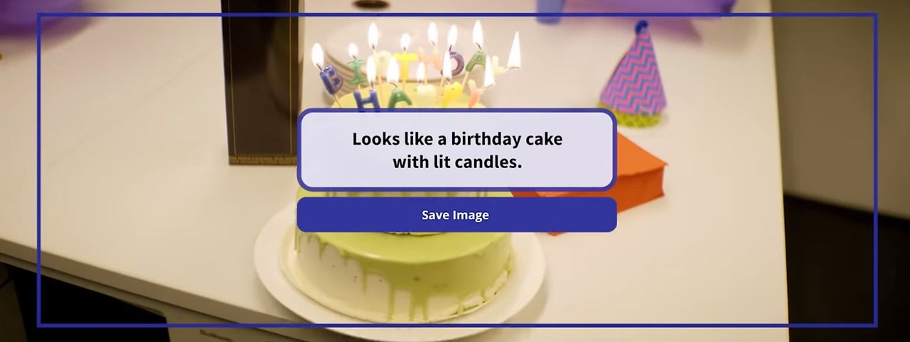Envision Glasses(인비전 글래스)를 소개하는 이미지2. 'Looks like a birthday cake with lit candles'라는 텍스트 오버레이와 함께 생일 케이크를 인식합니다.